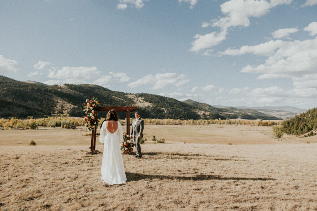 Bride walking towards Groom at ceremony