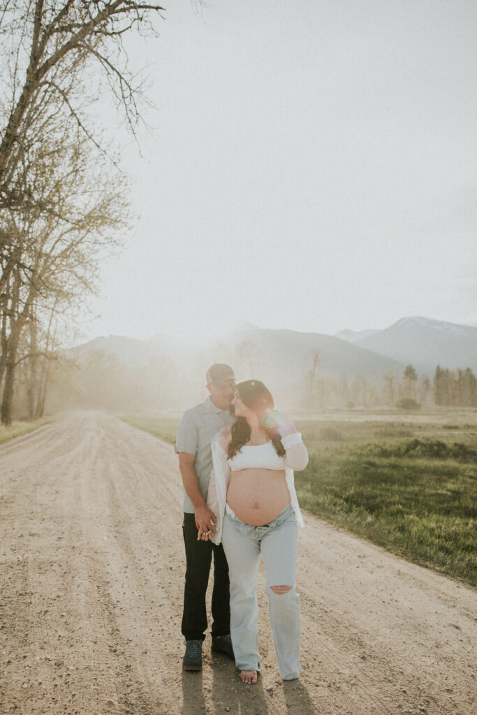 romantic outdoor bitterroot valley montana maternity photos with mountain views and natural light